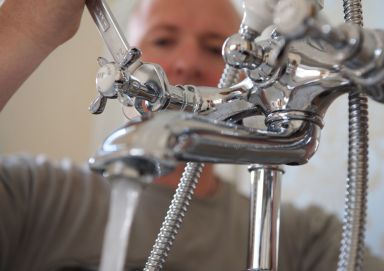 Our team installing plumbing fittings in Auckland